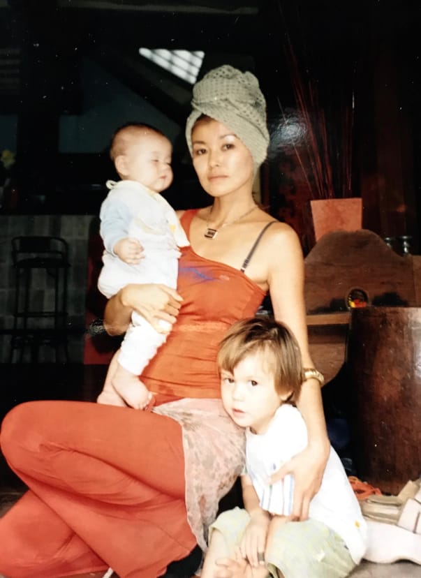 Cozi in her home in 2004 with her children